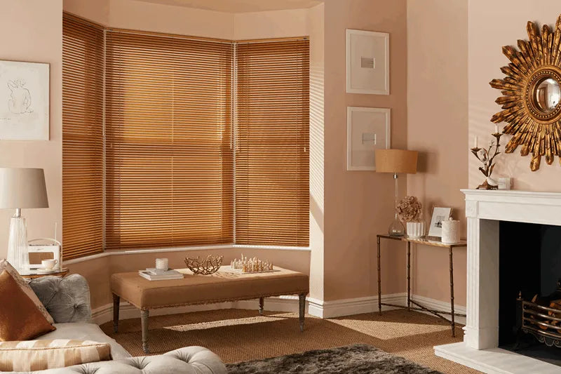 Living room with wooden blinds, sofa, and decorative elements.