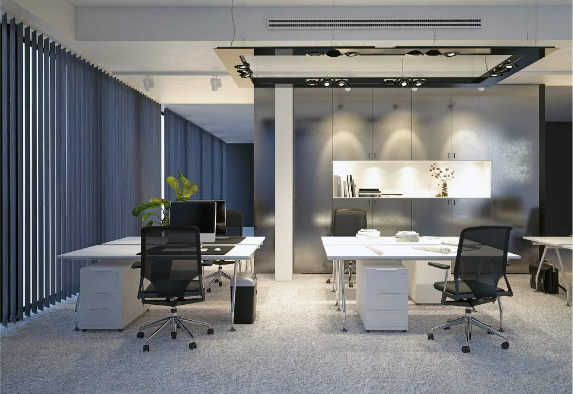 Modern office space with desks, chairs, and decor.